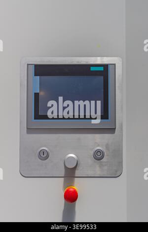 Big Touch Screen Machine Control With Emergency Stop Button Stock Photo