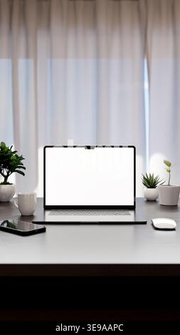 Laptop with blank screen on modern desk workspace. Clean home office setup with copy space for presentation. Rendering in 8k high resolution. Vertical Stock Photo