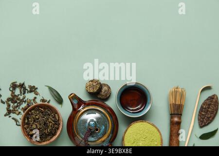 Composition with matcha tea and accessories on olive background Stock Photo
