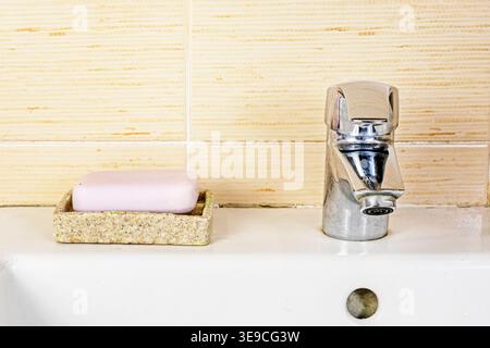 Mold and cracked silicone on the tile grout in the bathroom. Renovation. Stock Photo