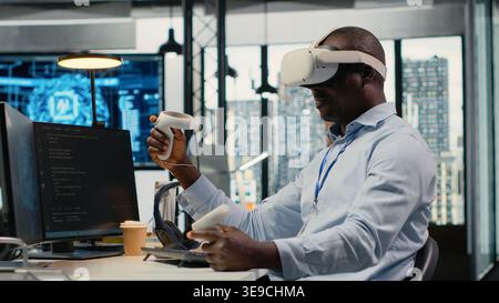 Technician in office using VR headset equipment to accelerate complex AI calculations. IT expert using virtual reality tech to manage machine learning training datasets, camera B Stock Photo
