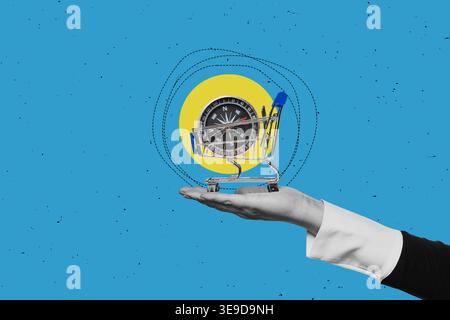 One hand holds shopping cart on blue background Stock Photo