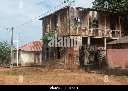 Old dilapidated building of colonial Portuguese architecture in Bolama town on Bolama Island, Bijagos Archipelago, Guinea Bissau. Stock Photo
