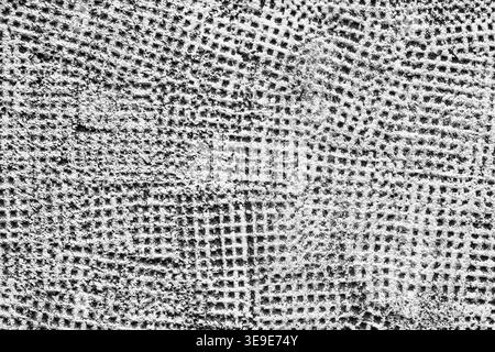 Abstract grunge background. White painted textured plaster. Meshy concrete wall surface close-up Stock Photo