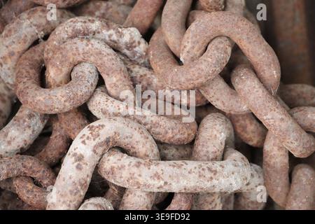 Old, rusty chains close up in an image. Stock Photo