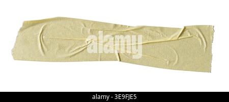 torn strip of crumpled beige masking tape isolated white background, adhesive paper surface with wrinkles and rough edges Stock Photo