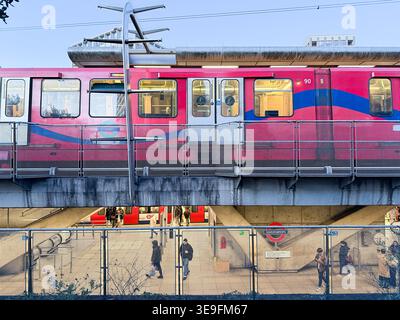DLR train and Jubilee Line platforms viewed at two levels during blue hour at Canning Town interchange, London. Captured April 17, 2026 Stock Photo
