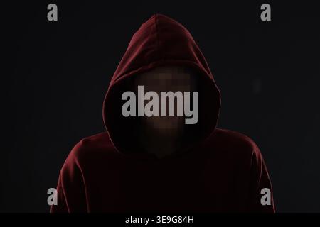 Anonymous man with pixelated face on black background Stock Photo