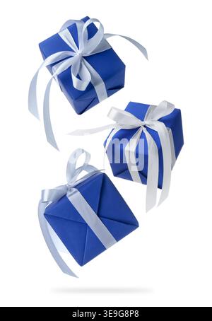 Gift boxes flying in air against white background Stock Photo