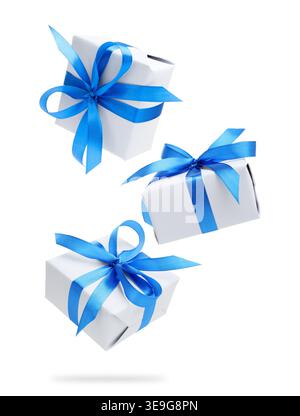 Gift boxes flying in air against white background Stock Photo