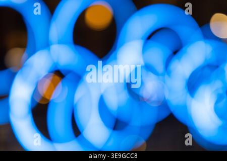 Blurred blue circular lights creating a bokeh effect Stock Photo