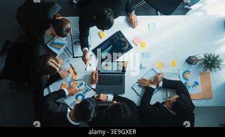 Top down aerial view of smart business man join meeting and present financial plan while diverse business people discuss and brainstorm marketing idea Stock Photo