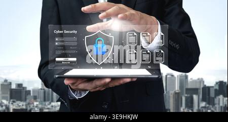 A businessman showcases a digital cyber security concept featuring a shield and lock symbols. The image reflects modern technology and highlights the Stock Photo
