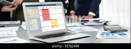 Panorama shot analyst team utilizing BI Fintech to analyze financial report with laptop. Businesspeople analyzing BI data dashboard displayed on Stock Photo