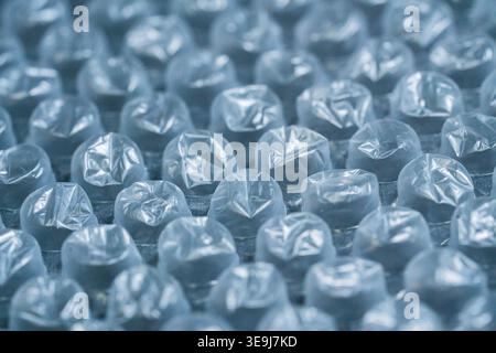Macro view of bubble wrap texture with repeating air pockets and soft focus depth Stock Photo