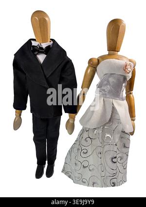 Bride and groom holding hands as they pose for pictures facing the camera Stock Photo