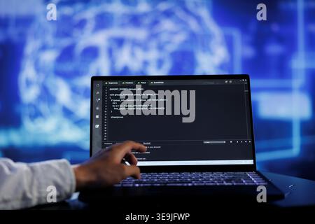 Admin writes code on laptop to visualize artificial intelligence neural networks using augmented reality technology, close up. Expert running AI script for data processing, blurry background Stock Photo