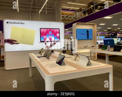 Promotion case study, Macbook Neo promotional screen in one British electrical retailer abnd aftercare service provider Stock Photo
