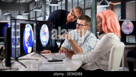 Environmental Scientist Leads Team Analyzing Climate Change Data On Screen. Stock Photo