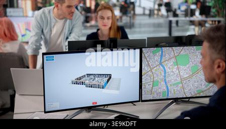 Architect Studies 3D Property Twin Using BIM And GIS Software Tools. Stock Photo