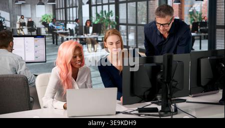 Manager Leads Diverse Team Training On Secure Document Management System. Stock Photo