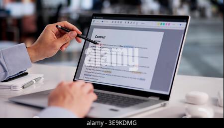 Hispanic Man Meticulously Edits Laptop Document, Correcting Grammar And Spelling Mistakes Stock Photo