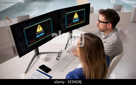 Ransomware Threat Strikes Business Computers. Cybersecurity Risks And Data Breach Concerns Stock Photo