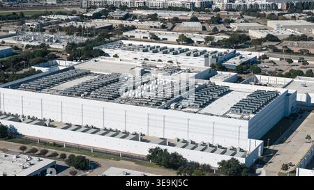 Large modern industrial data center building with rooftop cooling units for network infrastructure Stock Photo