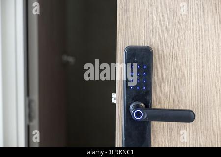 Modern smart digital door lock electronic security handle providing safe home environment feeling completely secure protected entering modern interior Stock Photo