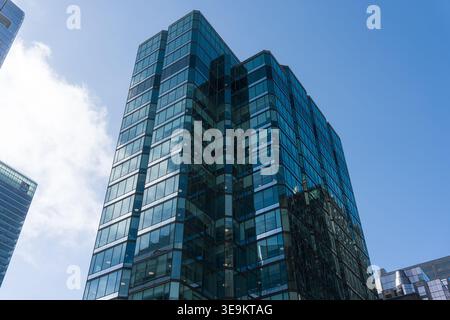 Toronto, Canada - April 17, 2026: Reflective glazing displays expansive sky scene combined with precise architectural Stock Photo