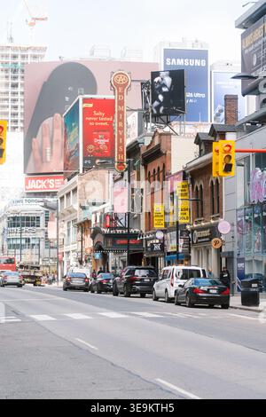Toronto, Canada - April 17, 2026: Crowded Yonge Street animation. Yonge Street teems with energetic crowds and colorful Stock Photo