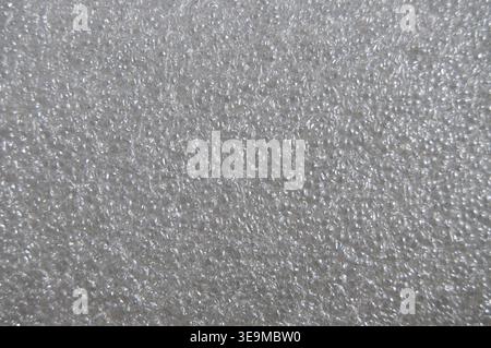 Polyethylene foam surface background. Gray bubbled texture. Stock Photo