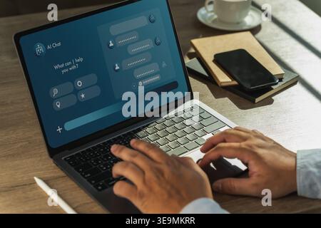 Futuristic AI customer support dashboard displayed on laptop with hands typing at workspace, illustrating chatbot help desk software, automated servic Stock Photo