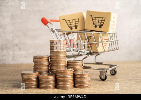 Shopping cart logo on box with stack of coins. Banking Account, Investment economy, trading, Business import export online company concept. Stock Photo