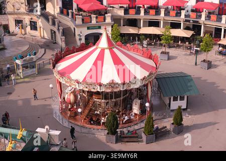 Prater Park, carousel and surrounding buildings, Vienna, Austria Stock Photo