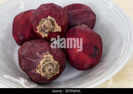 Five peeled beetroots waiting for cooking Stock Photo