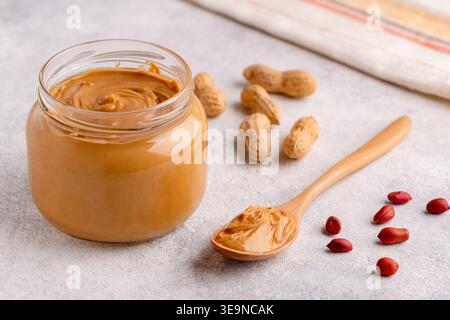 Peanut paste in an open jar Stock Photo