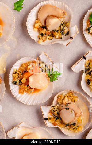 Cooked scallops with sauce on a baking sheet Stock Photo