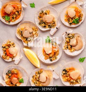 Cooked scallops with sauce on a baking sheet Stock Photo