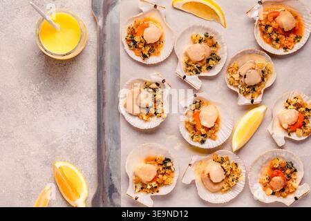 Cooked scallops with sauce on a baking sheet Stock Photo