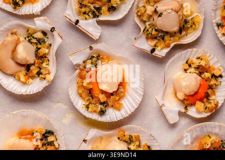 Cooked scallops with sauce on a baking sheet Stock Photo
