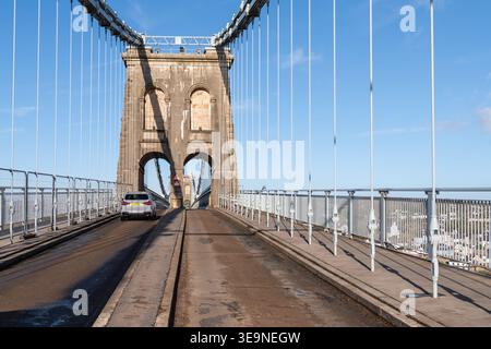 Car crossing Menai Bridge over the Swellies between North Wales and  Isle of Anglesey, North Wales, United kingdom Stock Photo