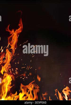 Barbeque poster fire with copy space. Fire embers particles over black background. Fire sparks background. Abstract dark glitter fire particles lights Stock Photo