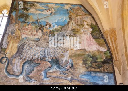 Svihov Castle wall fresco showing Saint George fighting a dragon, saving the princess Stock Photo