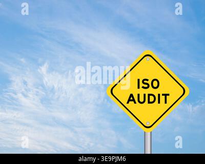 Yellow transportation sign with word iso audit on blue color sky background Stock Photo