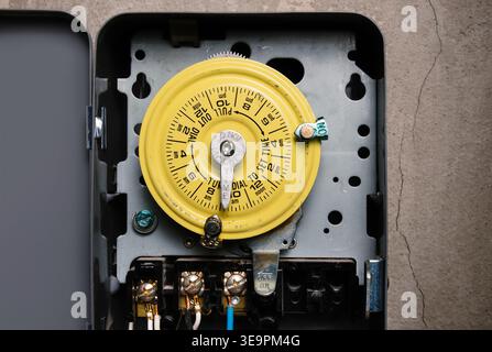 24h mechanical time switch with on off trippers. Dial timer or time clock for residential or commercial use. Electrical control device for lighting, h Stock Photo