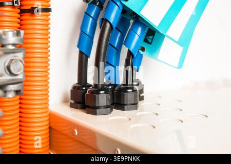 Fiber distribution box with fiber optics cable. Building fiber network distribution box with innerduct conduits. Close up. Fiber optics installation o Stock Photo