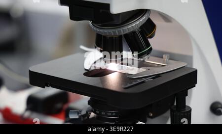Microscope. Advanced microscopes and digital imaging systems analyzing samples in a modern laboratory. Ideal for medical research microbiology diagnos Stock Photo