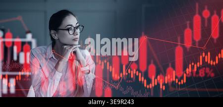 Businesswoman Analyzing Financial Data During Late Night Work Hours Stock Photo