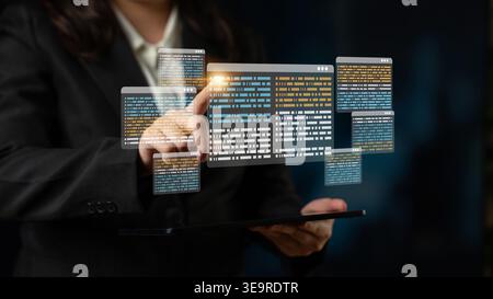 A business professional engages with a digital data display on a tablet, representing innovation in technology and data management in a modern office Stock Photo